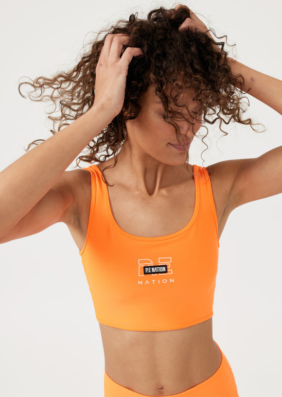 P.E NATION BRA GRAND STAND IN FLURO ORANGE
