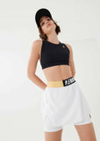 P.E NATION SHORT BACKSWING SKIRT IN WHITE